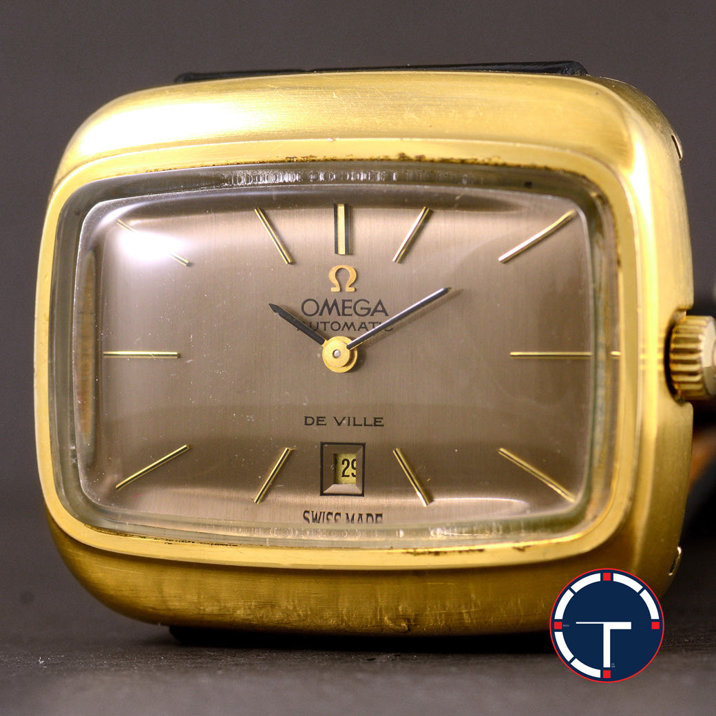 นาฬิกา Omega De Ville หน้าปัดสีทองเข้ม กะไหล่ทอง ทรงสีเหลี่ยมผืนผ้า Automatic ขนาด 31x36 mm