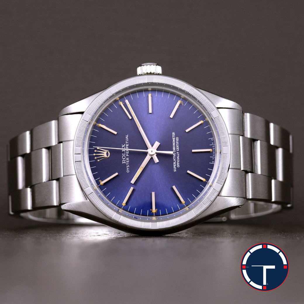 นาฬิกา Rolex Oyster Perpetual Ref.1007 Sigma Dial หน้าปัดฟ้าอมม่วง หลังชั่วโมงทองคำSigma ขอบรางรถไฟ สายOysterแท้ นาฬิกาปี1974 Automatic ขนาด 34 mm