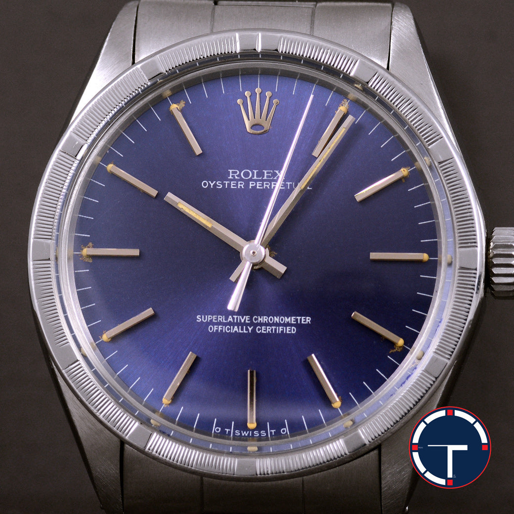 นาฬิกา Rolex Oyster Perpetual Ref.1007 Sigma Dial หน้าปัดฟ้าอมม่วง หลังชั่วโมงทองคำSigma ขอบรางรถไฟ สายOysterแท้ นาฬิกาปี1974 Automatic ขนาด 34 mm