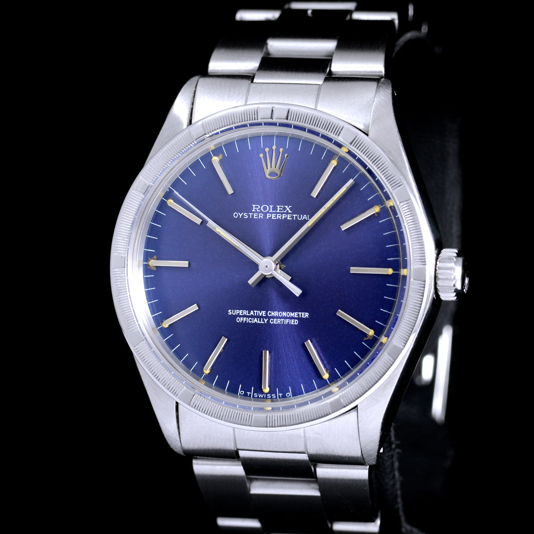นาฬิกา Rolex Oyster Perpetual Ref.1007 Sigma Dial หน้าปัดฟ้าอมม่วง หลังชั่วโมงทองคำSigma ขอบรางรถไฟ สายOysterแท้ นาฬิกาปี1974 Automatic ขนาด 34 mm